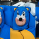 Argick dressed in his awful Sonic outfit, in three different poses.